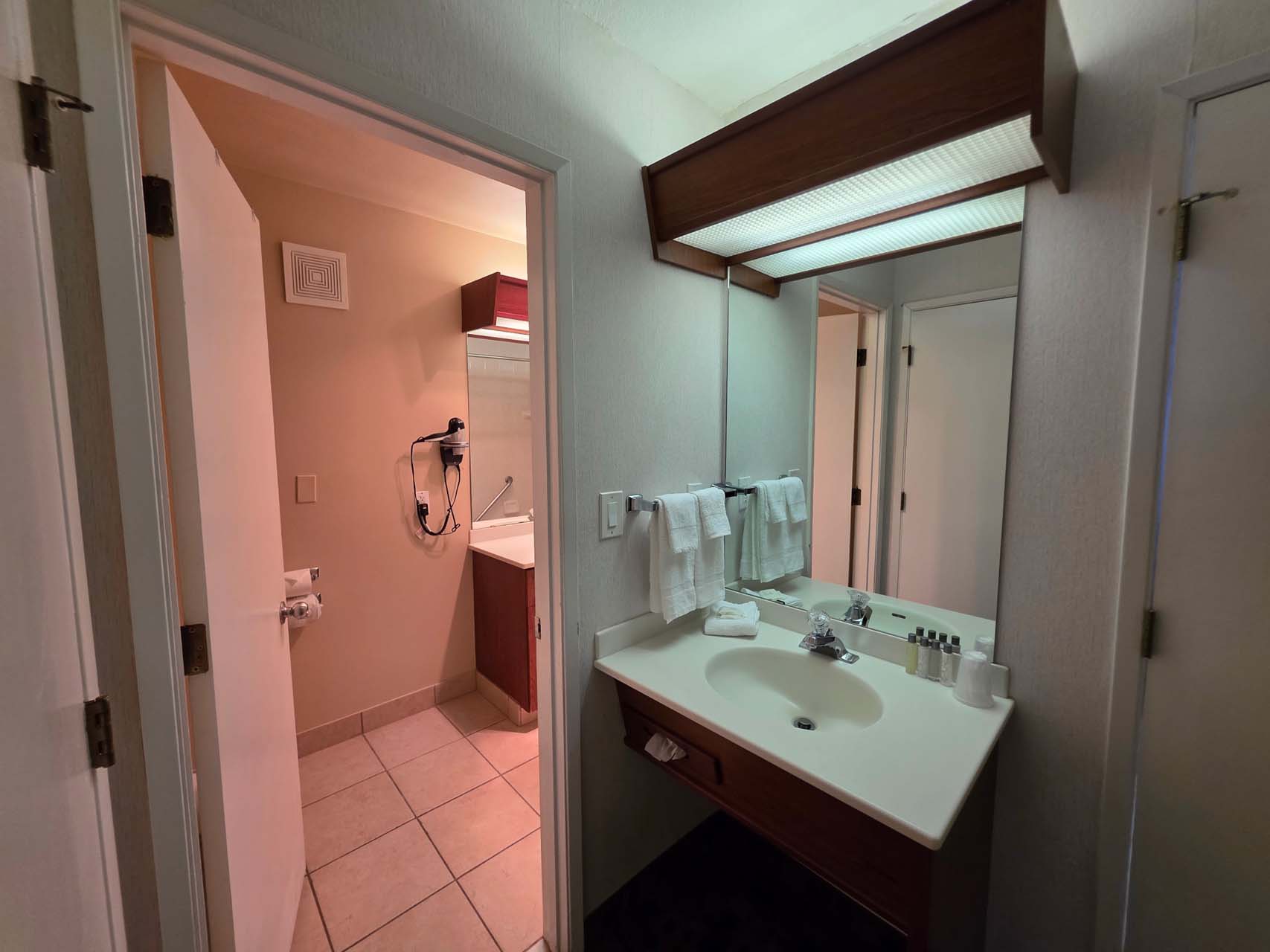 Entryway to the guest bathroom next to a sink